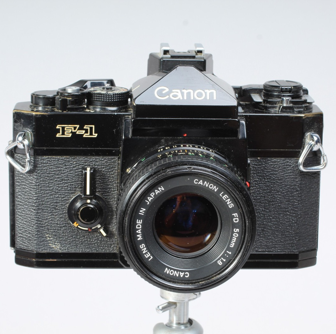 CANON F1 W 50MM F/1.8 FD LENS, HOOD, FLASH MOUNT & CAP SHUTTER GOOD METER IN-OP